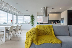 Modern Meets Convenience in this Beachfront Oasis